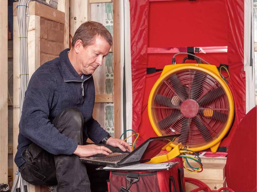 Blower door test for a home energy audit.